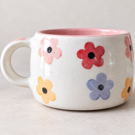 Close-up of multicolor floral ceramic cup glossy finish