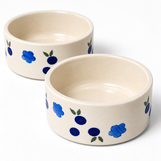 Blue floral ceramic serving bowls on white background