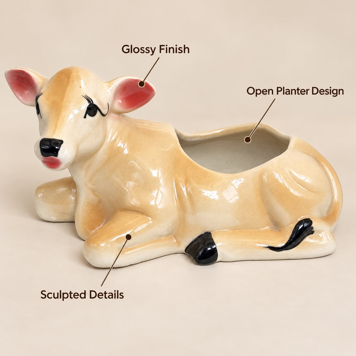 Cow ceramic planter showing glossy finish, open planter design and sculpted details