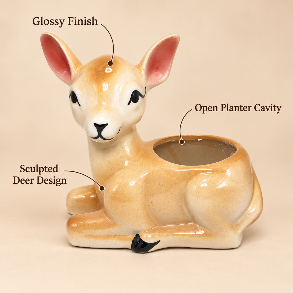 Deer shaped ceramic indoor planter showing glossy finish, sculpted deer design and open planter cavity