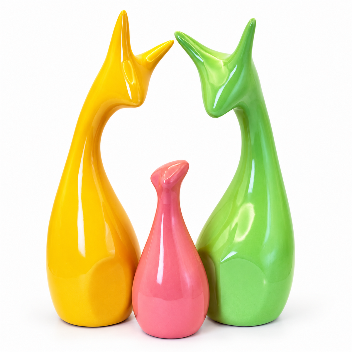 Close up of glossy yellow green and pink ceramic deer family decor