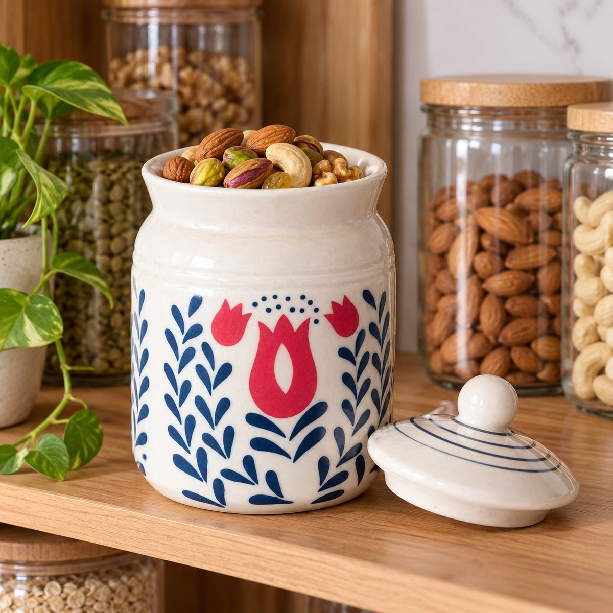 White floral ceramic jar shown with dry fruits