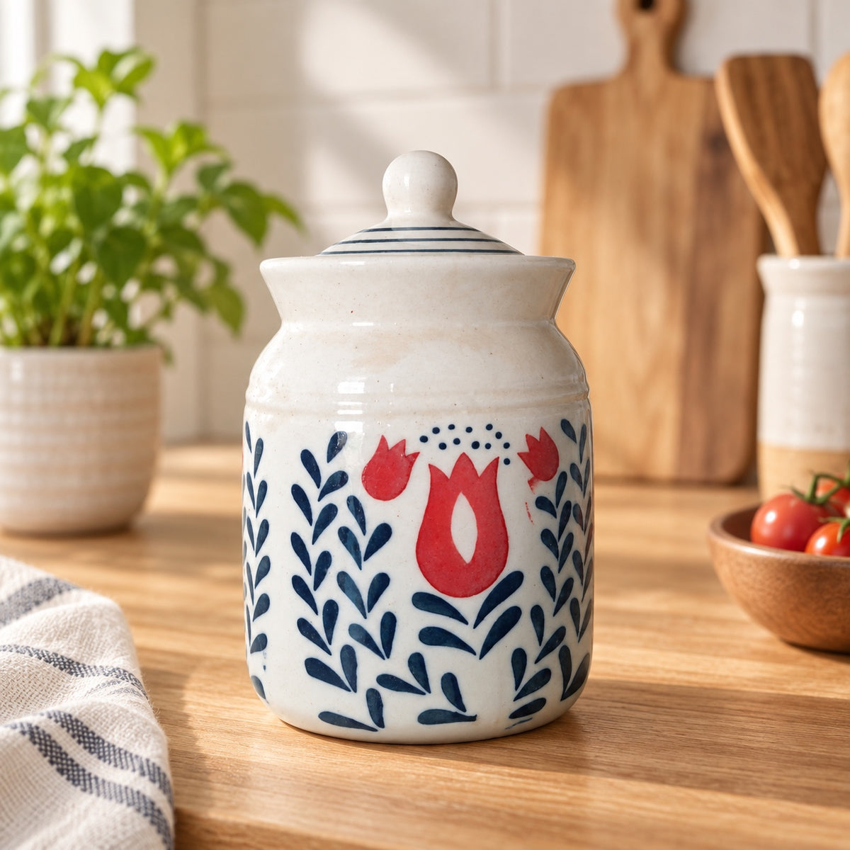 White floral ceramic storage jar styled on kitchen counter